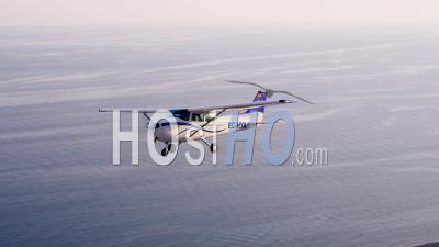 Cessna 172 Flying Over Sea And Coastline