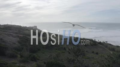 Nazare's Lighthouse On A Misty Morning - Video Drone Footage