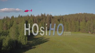 Helicopter Flying Above A Fir Trees Forest, Tackasen, Sweden - Video Drone Footage