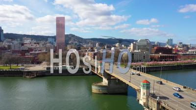 Aerial Over Burnside Bridge Portland Oregon Stag Deer Sign And Downtown Old Town Cityscape And Business District. - Video Drone Footage