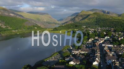 Sprawling Lush Green Landscape And A Provincial Village In Snowdonia Wales Uk - Aerial Shot - Video Drone Footage