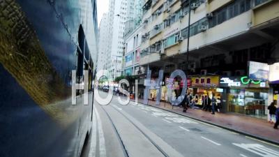 Side View Of A Blue Double-Decker Bus Travelling On The Road In Hong Kong - Timelapse