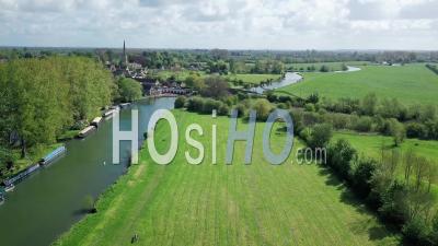 Scenic View At Lush Green Trees And Grassfields With River Thames In Abingdon Town, Oxford City, Uk.- Aerial Drone Shot