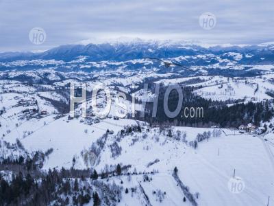 Snowy Winter Landscape In The Carpathian Mountains, Bran, Transylvania, Romania - Aerial Photography