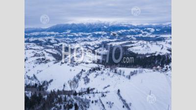 Snowy Winter Landscape In The Carpathian Mountains, Bran, Transylvania, Romania - Aerial Photography