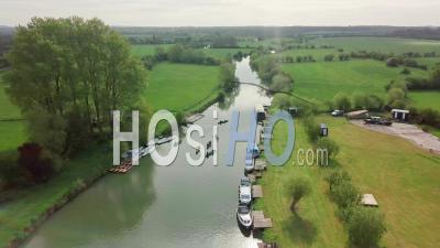 Tourists Kayaking With Boats Moored On The River Thames In Abingdon Near Oxford City, Uk - Aerial Drone