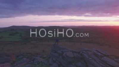 Photographer In Dartmoor National Park At Sunrise, Devon, England, Uk. Aerial Drone View
