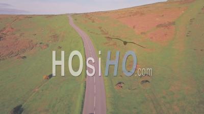 Car Driving In Dartmoor National Park, Devon, England, Uk. Aerial Drone View