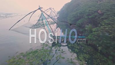 Traditional Chinese Fishing Nets At Sunrise, Fort Kochi, India. Aerial Drone View