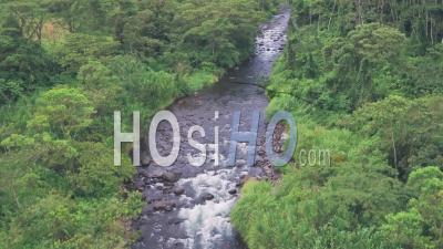 River Through Tropical Rainforest At Arenal Volcano National Park, Costa Rica. Aerial Drone View