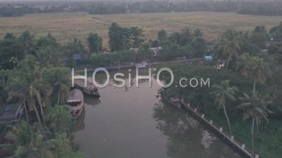 Houseboats In Kerala Backwaters And Local Life At Sunset At Alleppey, India. Aerial Drone View