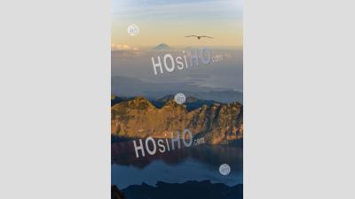 Sunrise View Of Mount Segara Anak Lake, Mount Agung And The Thre Gili Isles From The Summit Of Mount Rinjani, Lombok, Indonesia