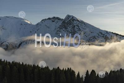 Dramatic Mountain Tops And Low Lying Mist And Clouds In Beautiful Sunset Light In The Ski Resort Of Avoriaz, France, Europe