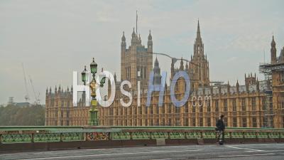 London In Coronavirus Covid-19 Lockdown With One Person Commuting Using Onewheel One Wheel Electric Skateboard Segway In Deserted Empty Streets By Houses Of Parliament In England, Uk