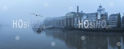 Butlers Wharf Pier And River Thames In Thick Fog And Mist, On A Cool Blue Morning In Foggy And Misty Moody Weather In London City Centre During Covid-19 Coronavirus Lockdown, England, Uk
