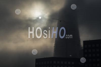 The Shard In London With Dramatic Moody Clouds And Mist Moving And The Sun Rising On A Misty Foggy Morning In London, Shot In The Covid-19 Coronavirus Lockdown In England, Europe