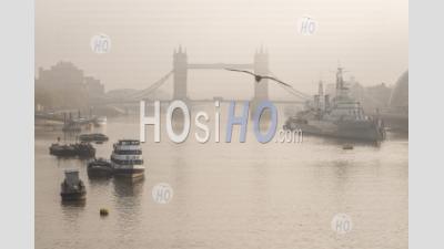Tower Bridge With Red London Bus Driving Over It In London In Foggy Misty Weather, With The River Thames In Beautiful Mysterious Atmospheric Light, Shot In Coronavirus Covid-19 Lockdown In England, Europe