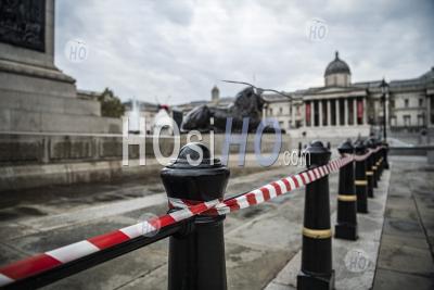 Trafalgar Square Lions Taped Off For Health And Safety And Social Distancing In Covid-19 Coronavirus Lockdown In London, Uk, Europe, With Quiet, Empty Streets In Central London