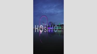 Vertical Video Of The London Eye And Thames River At Night, An Iconic London Building And Famous Tourist Attraction, Shot In Coronavirus Covid-19 Lockdown, South Bank, England, Europe