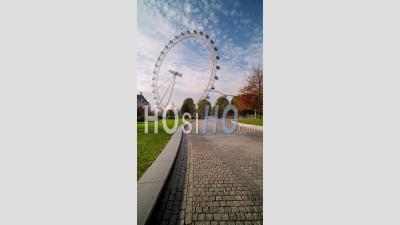 Vertical Video Of The London Eye, An Iconic London Building And Famous Tourist Attraction By Jubilee Gardens, Shot In Coronavirus Covid-19 Lockdown With Empty Streets, South Bank, England, Europe