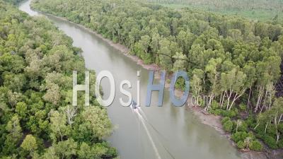Fishing Boat At The River Of Mangrove Trees At Batu Kawan - Video Drone Footage