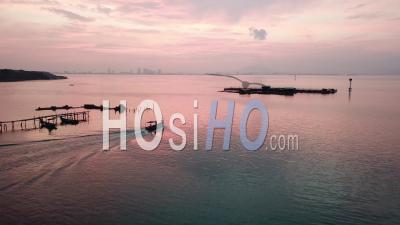A Boat Leaving Fishing Jetty At Jelutong - Video Drone Footage