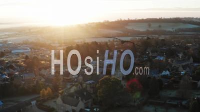 Aerial Drone Video Of Typical English Village And Beautiful British Countryside Scenery In The Cotswolds Showing A Rural Church At Sunrise In Beautiful Morning Light At Longborough, Gloucestershire, England, United Kingdom