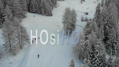 Skiers Climbing And Skiing In Closed Ski Resort - Video Drone Footage