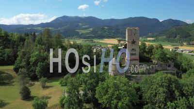 Castle On The Mountain Surrounded By Green Forest - Video Drone Footage
