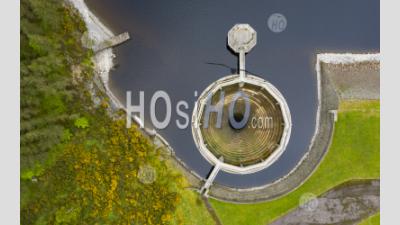 Looking Down On Circular Spillway At Whiteadder Reservoir , East Lothian, Scotland Uk - Aerial Photography