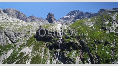 Waterfall In The Glacial Cirque Of Sommeiller, Italy, Viewed From Drone