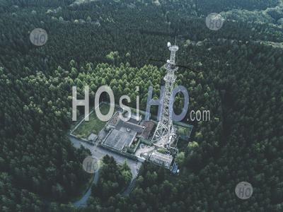 Aerial: Drone Shot Of Old Abandoned Radio Tower Station In Rich Green Forest Surrounded By Trees Hq