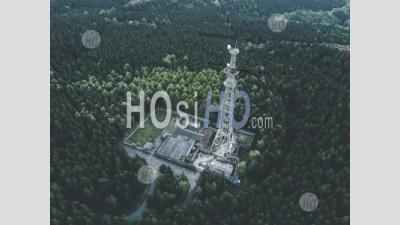 Aerial: Drone Shot Of Old Abandoned Radio Tower Station In Rich Green Forest Surrounded By Trees Hq