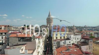 Scenic Wide View Of Famous Galata Tower In The Heart Of Istanbul On Clear Blue Sky Day, Slow Aerial Dolly Forward - Video Drone Footage