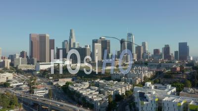 Flying Towards Downtown Los Angeles, California Skyline With Sports Football Baseball And Tennis Field At Beautiful Blue Sky And Sunny Day 4k - Video Drone Footage