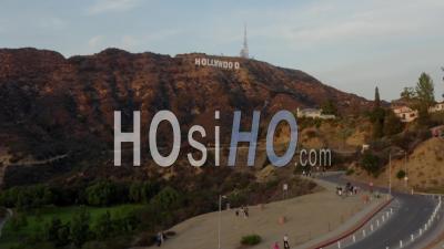 Wide Shot Flying Towards Hollywood Sign Letters At Sunset, Los Angeles, California 4k - Video Drone Footage