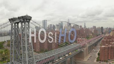 Close Up Aerial Dolly Shot Of Slow Moving Rush Hour Traffic Across Williamsburg Bridge Passing Residential Buildings In Manhattan 4k - Video Drone Footage
