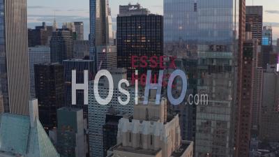 Close Up Of Essex House Manhattan Skyline At Wonderful Sunset With Flashing City Lights In New York City At Central Park In Beautiful 4k - Video Drone Footage