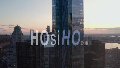 Epic View Of Enormous New Manhattan Skyscraper At Sunset With Traffic Lights In Beautiful 4k - Video Drone Footage