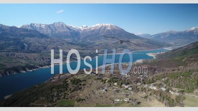 Pontis And The Lake Of Serre-Ponçon, In The Hautes-Alpes, France, Viewed From Drone