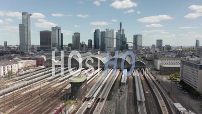 Aerial View Forward Flight Over Frankfurt Am Main, Germany Central Train Station Train Tracks With Skyline View On Beautiful Summer Day With Little Traffic Due To Coronavirus Covid 19 Pandemic - Video Drone Footage