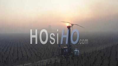Aerial View, Anti-Frost Wind Machine In Bordeaux Vineyard During Sub-Zero Temperatures - Video Drone Footage