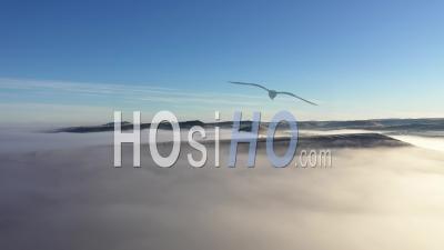 Aerial View Of Hills In Mystic Foggy Winter Morning - Video Drone Footage