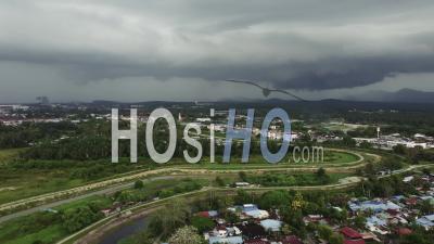 Aerial Ascending Look Down During Cloudy Day Before Raining - Video Drone Footage