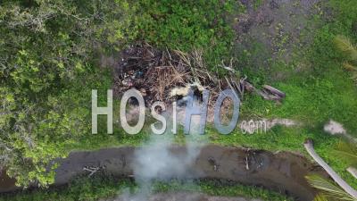 Aerial Look Down Open Burn At Farm - Video Drone Footage