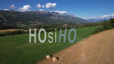 Fields And Meadows Near The Village Of Bâtie-Vieille, Hautes-Alpes, France, Viewed From Drone