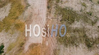 Top Down View The Wheel Track Of Soil Of Truck During Land Clearing - Video Drone Footage