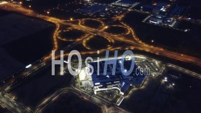 Aerial Night View Of Ikea Store And Clover Shape Interchange At Night - Video Drone Footage