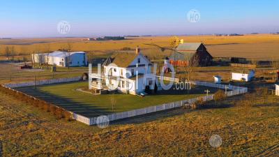 Aerial Photo Drone  Over A Classic Beautiful Farmhouse Farm And Barns In Rural Midwest America, York, Nebraska