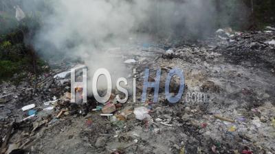 Rotating Tracking Open Burn Rubbish At Illegal Dumping - Video Drone Footage